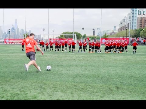 Bayern Munich's Xabi Alonso and Arturo Vidal vs. 40 children